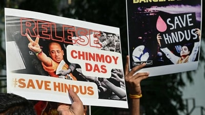 Devotees and members of the International Society for Krishna Consciousness (ISKCON) hold posters during a protest outside the Bangladesh high commission in Mumbai on December 2 amid the unrest in Bangladesh after the arrest of Hindu monk Chinmoy Krishna Das Brahmachari. (AFP) Devotees and members of the International Society for Krishna Consciousness (ISKCON) hold posters during a protest outside the Bangladesh high commission in Mumbai on December 2 amid the unrest in Bangladesh after the arrest of Hindu monk Chinmoy Krishna Das Brahmachari. (AFP)