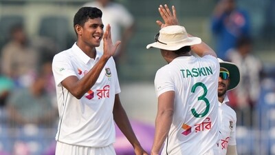Bangladesh's Nahid Rana, left, celebrates with teammates (AP) Bangladesh's Nahid Rana, left, celebrates with teammates (AP)