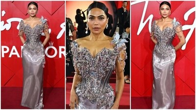 Mona Patel wore a corset from the archival Christian Lacroix Haute Couture collection. The remarkable piece of fashion history hails from the esteemed Spring-Summer 1996 collection. As per reports, the corset was sold for USD 169,828.65 at an auction, which is approximately <span class='webrupee'>₹</span>1.43 crore. It is meticulously hand-woven from metallic silk taffeta and embroidered with lavish embellishments. Mona Patel wore a corset from the archival Christian Lacroix Haute Couture collection. The remarkable piece of fashion history hails from the esteemed Spring-Summer 1996 collection. As per reports, the corset was sold for USD 169,828.65 at an auction, which is approximately <span class='webrupee'>₹</span>1.43 crore. It is meticulously hand-woven from metallic silk taffeta and embroidered with lavish embellishments. 
