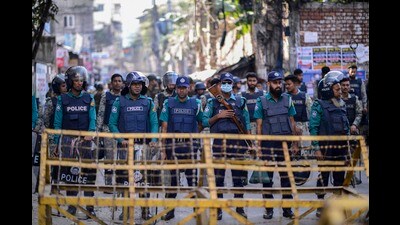 Police officers stand guard outside Indian High commission after a call for anti India protests following a group of Hindus in Agartala, the capital of the northeastern Indian state of Tripura, stormed a consulate office of Bangladesh, in Dhaka, Bangladesh, Tuesday, Dec. 3, 2024. AP/PTI (AP) Police officers stand guard outside Indian High commission after a call for anti India protests following a group of Hindus in Agartala, the capital of the northeastern Indian state of Tripura, stormed a consulate office of Bangladesh, in Dhaka, Bangladesh, Tuesday, Dec. 3, 2024. AP/PTI (AP)