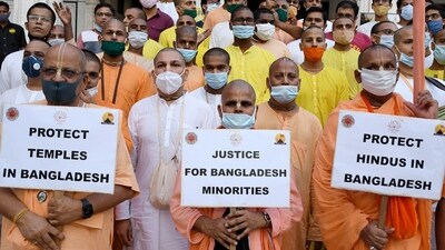 ISKON priests hold placards during a protest against violence in Bangladesh. (ANI File Photo) ISKON priests hold placards during a protest against violence in Bangladesh. (ANI File Photo)