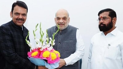 Union minister Amit Shah, Maharashtra BJP leader Devendra Fadnavis, Shiv Sena leader Eknath Shinde exchange greetings during a meeting at BJP president JP Nadda's residence in New Delhi, on Thursday. (PTI) Union minister Amit Shah, Maharashtra BJP leader Devendra Fadnavis, Shiv Sena leader Eknath Shinde exchange greetings during a meeting at BJP president JP Nadda's residence in New Delhi, on Thursday. (PTI)