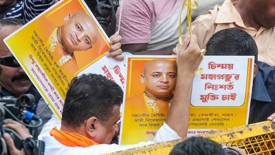 BJP leader Suvendu Adhikari holds posters of spiritual leader Chinmoy Krishna Das who was arrested in Bangladesh during a protest for Das's release and against the alleged atrocities on Hindus in the neighbouring country. (PTI) BJP leader Suvendu Adhikari holds posters of spiritual leader Chinmoy Krishna Das who was arrested in Bangladesh during a protest for Das's release and against the alleged atrocities on Hindus in the neighbouring country. (PTI)