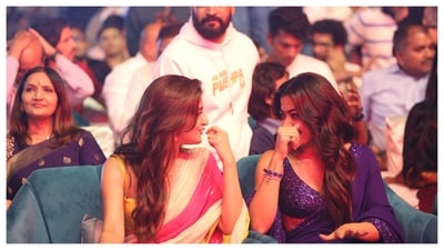 Sreeleela and Rashmika Mandanna were spotted sharing a laugh at the event. The film releases in theatres on December 5. Sreeleela and Rashmika Mandanna were spotted sharing a laugh at the event. The film releases in theatres on December 5.