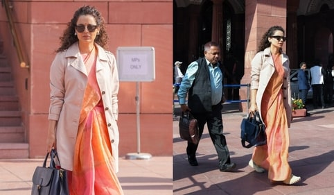 Kangana paired her saree with a trenchcoat. Kangana paired her saree with a trenchcoat.