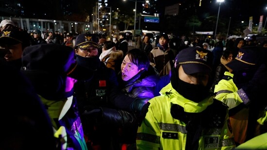 A man confronts police officers outside the National Assembly, after South Korean President Yoon Suk Yeol declared martial law, in Seoul, South Korea, December 4, 2024.(Reuters)