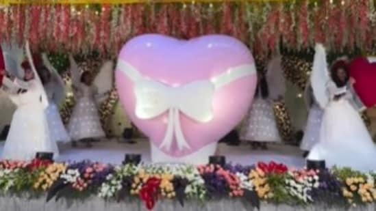 A viral wedding video showed a surprising 'heart blast' entry, sparking mixed reactions online. (Instagram/modernwedevents)