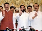 Shiv Sena chief Eknath Shinde, BJP leader Devendra Fadnavis and NCP chief Ajit Pawar show victory signs after staking claim to form the government in Maharashtra, at Raj Bhawan in Mumbai on Wednesday.