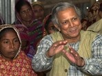FILE- Professor Mohammed Yunus, founder of Grameen Bank, a micro credit institution, explains to villagers the benefits of the system at Kalampur village in Dhaka, Bangladesh, FILE- Professor Mohammed Yunus, founder of Grameen Bank, a micro credit institution, explains to villagers the benefits of the system at Kalampur village in Dhaka, Bangladesh,