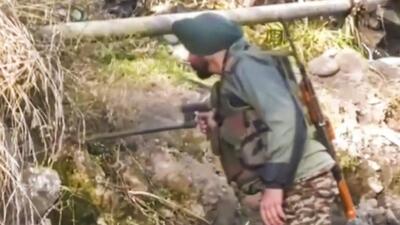 A member of the bomb disposal team conducts a search near the army post in Poonch. (PTI) A member of the bomb disposal team conducts a search near the army post in Poonch. (PTI)
