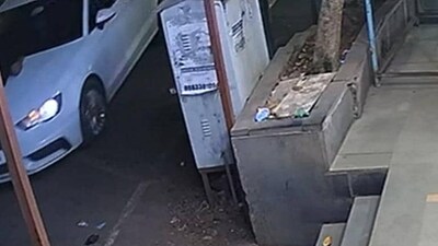 A video grab shows the motorcyclist on the bonnet of the Audi. The car allegedly dragged the 23-year-old for over three kilometres in Chinchwad on Sunday, officials said on Tuesday (HT) A video grab shows the motorcyclist on the bonnet of the Audi. The car allegedly dragged the 23-year-old for over three kilometres in Chinchwad on Sunday, officials said on Tuesday (HT)