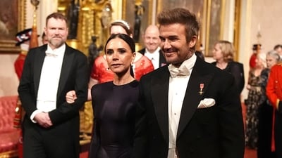 David and Victoria Beckham make their way along the East Gallery to attend the state banquet for the Emir of Qatar Sheikh Tamim bin Hamad Al Thani at Buckingham Palace, during his state visit to the UK, London, Britain, December 3, 2024. (via REUTERS /  Aaron Chown / Pool)