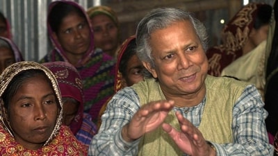 FILE- Professor Mohammed Yunus, founder of Grameen Bank, a micro credit institution, explains to villagers the benefits of the system at Kalampur village in Dhaka, Bangladesh, (AP) FILE- Professor Mohammed Yunus, founder of Grameen Bank, a micro credit institution, explains to villagers the benefits of the system at Kalampur village in Dhaka, Bangladesh, (AP)