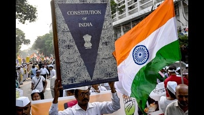 Each part of the Constitution begins with an illustration, and pages have distinct border designs. (Photo by Dibyangshu SARKAR / AFP) (AFP)