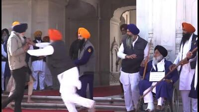 Footage showed the shooter walking towards Badal and pulling out a gun from his pocket. (PTI) Footage showed the shooter walking towards Badal and pulling out a gun from his pocket. (PTI)