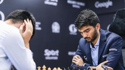 India's D Gukesh plays against China’s Ding Liren during the eighth game of the World Chess Championship in Singapore on Wednesday. (PTI)