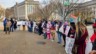 Members of the Hindu community from Bangladesh stage a rally at the White House demanding release of Chinmaya Das and protection for the community. (PTI Photo) (PTI) Members of the Hindu community from Bangladesh stage a rally at the White House demanding release of Chinmaya Das and protection for the community. (PTI Photo) (PTI)
