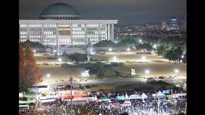 Police officers block protesters outside the National Assembly after South Korean President Yoon Suk Yeol declared martial law in Seoul. (via REUTERS)