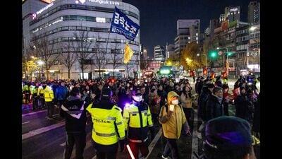 Protesters against South Korean President Yoon Suk Yeol march towards the presidential office during a demonstration in Seoul, South Korea, on Wednesday, Dec. 4, 2024. Photographer: Jean Chung/Bloomberg (Bloomberg) Protesters against South Korean President Yoon Suk Yeol march towards the presidential office during a demonstration in Seoul, South Korea, on Wednesday, Dec. 4, 2024. Photographer: Jean Chung/Bloomberg (Bloomberg)