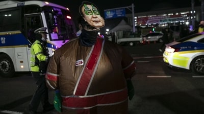 A protester against South Korean President Yoon Suk Yeol outside the National Assembly in Seoul. (Bloomberg) A protester against South Korean President Yoon Suk Yeol outside the National Assembly in Seoul. (Bloomberg)