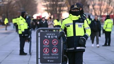 Policemen stand guard at Gwanghwamun Square in downtown Seoul on December 4, 2024, after martial law was lifted. (AFP) Policemen stand guard at Gwanghwamun Square in downtown Seoul on December 4, 2024, after martial law was lifted. (AFP)