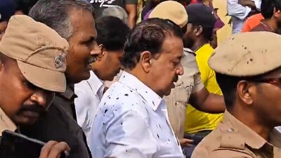 Tamil Nadu Forest Minister K Ponmudy with mud stains on Tuesday during relief distribution. (X) Tamil Nadu Forest Minister K Ponmudy with mud stains on Tuesday during relief distribution. (X)