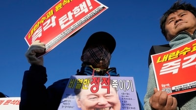 Protesters attend a rally to demand South Korean President Yoon Suk Yeol to step down in front of the National Assembly in Seoul. (AP) Protesters attend a rally to demand South Korean President Yoon Suk Yeol to step down in front of the National Assembly in Seoul. (AP)