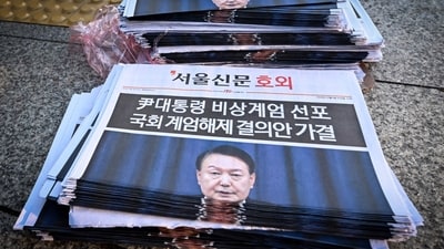 Extra edition newspapers are displayed at a subway gate in downtown Seoul on December 4, 2024, after martial law was lifted. South Korean President Yoon Suk Yeol abandoned a short-lived attempt at martial law on December 4, after lawmakers defied security forces to vote against his declaration and thousands of protesters took to the streets. (AFP) Extra edition newspapers are displayed at a subway gate in downtown Seoul on December 4, 2024, after martial law was lifted. South Korean President Yoon Suk Yeol abandoned a short-lived attempt at martial law on December 4, after lawmakers defied security forces to vote against his declaration and thousands of protesters took to the streets. (AFP)