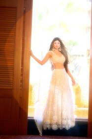 Shilpa looks mesmerising in a net and organza embroidered lehenga. It boasts of a fully embellished blouse and skirt, complemented with a subtly highlighted dupatta. Shilpa looks mesmerising in a net and organza embroidered lehenga. It boasts of a fully embellished blouse and skirt, complemented with a subtly highlighted dupatta.