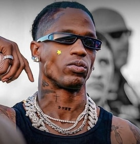 Travis Scott wearing a bright yellow star-shaped acne patch (Photo: Instagram)