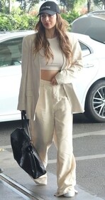 Malaika Arora in a head-to-toe monotone look in beige with a crop top, flared trousers and an oversized blazer (Photo: Instagram) Malaika Arora in a head-to-toe monotone look in beige with a crop top, flared trousers and an oversized blazer (Photo: Instagram)