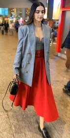 Sonam Kapoor Ahuja in an oversized grey blazer, a grey corset top and a bright red maxi skirt (Photo: Instagram) Sonam Kapoor Ahuja in an oversized grey blazer, a grey corset top and a bright red maxi skirt (Photo: Instagram)