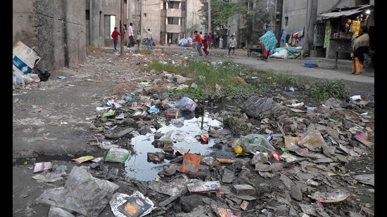 Garbage strewn on a road near Basic Services for Urban Poor flats in Ludhiana. (Manish/HT)
