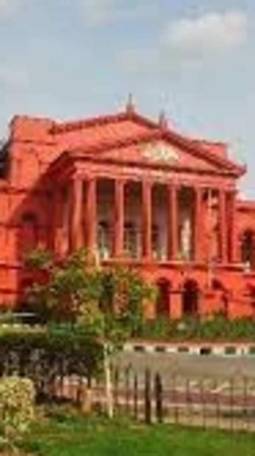 Karnataka High Court directed the Bengaluru BDA to prepare a plan to demolish an entire residential building tower if the builder fails to remove two illegally constructed floors.