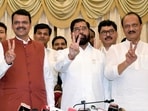 Shiv Sena chief Eknath Shinde, BJP leader Devendra Fadnavis and NCP chief Ajit Pawar show victory signs after staking claim to form the government in Maharashtra, at Raj Bhawan in Mumbai on Wednesday. 