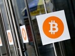 Bitcoin logos are displayed at the Inside Bitcoins conference and trade show on April 7, 2014, in New York. Bitcoin has topped the $100,000 mark Bitcoin logos are displayed at the Inside Bitcoins conference and trade show on April 7, 2014, in New York. Bitcoin has topped the $100,000 mark