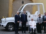 Pope Francis (C) poses with Mercedes CEO Ola Kallenius (2ndR) and Mercedes managers as he's presented a new fully electric popemobile, at the Vatican. Pope Francis (C) poses with Mercedes CEO Ola Kallenius (2ndR) and Mercedes managers as he's presented a new fully electric popemobile, at the Vatican.