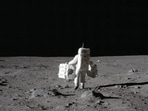 In this July 20, 1969 photo made available by NASA, lunar module pilot Buzz Aldrin carries a seismic experiments package in his left hand and the Laser Ranging Retroreflector to the deployment area on the surface of the moon at Tranquility Base. On Tuesday, Oct. 13, 2020, NASA released a set of guidelines for its Artemis moon-landing program, based on the 1967 Outer Space Treaty and other agreements.(AP)