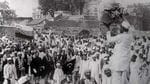 Hindus and Muslims, displaying the flags of both the Indian National Congress and the Muslim League, collecting clothes to be later burnt as a part of the Non-cooperation movement of Mohandas Gandhi in 1922. (Wikimedia Commons)