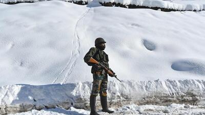 (FILES) Indian army soldier stands on a snow-covered road near Zojila mountain pass that connects Srinagar to the union territory of Ladakh, bordering China (AFP FILE/Representative Image) (FILES) Indian army soldier stands on a snow-covered road near Zojila mountain pass that connects Srinagar to the union territory of Ladakh, bordering China (AFP FILE/Representative Image)