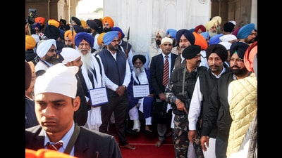 Amritsar, Dec 04 (ANI): Former Punjab Deputy Chief Minister Sukhbir Singh Badal moves under heightened security following an assassination attempt on him while he was serving his penance at the entrance of the Golden Temple, in Amritsar on Wednesday. (ANI Photo) (Raminder Pal Singh) Amritsar, Dec 04 (ANI): Former Punjab Deputy Chief Minister Sukhbir Singh Badal moves under heightened security following an assassination attempt on him while he was serving his penance at the entrance of the Golden Temple, in Amritsar on Wednesday. (ANI Photo) (Raminder Pal Singh)