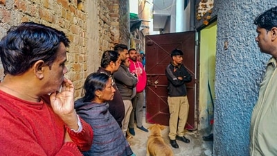Police personnel and others at a house at Neb Sarai area where a middle-aged couple and their daughter were found dead. (PTI) Police personnel and others at a house at Neb Sarai area where a middle-aged couple and their daughter were found dead. (PTI)