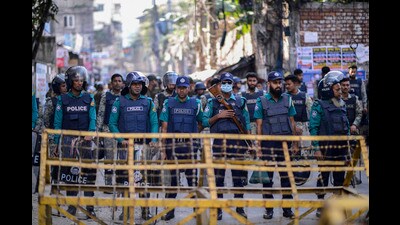Police officers stand guard outside Indian High commission after a call for anti India protests following a group of Hindus in Agartala, the capital of the northeastern Indian state of Tripura, stormed a consulate office of Bangladesh, in Dhaka, Bangladesh, Tuesday, Dec. 3, 2024. (AP Photo/Mahmud Hossain Opu) (AP) Police officers stand guard outside Indian High commission after a call for anti India protests following a group of Hindus in Agartala, the capital of the northeastern Indian state of Tripura, stormed a consulate office of Bangladesh, in Dhaka, Bangladesh, Tuesday, Dec. 3, 2024. (AP Photo/Mahmud Hossain Opu) (AP)