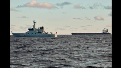 The Chinese ship, the bulk carrier Yi Peng 3 (R) is anchored and being monitored by a Danish naval patrol vessels in the sea of Kattegat, near the City og Granaa in Jutland, Denmark, on November 20, 2024. Denmark's navy said on November 20, 2024 it was shadowing a Chinese cargo vessel in the Baltic Sea, a day after Finland and Sweden opened investigations into suspected sabotage of two severed undersea telecoms cables. (Photo by Mikkel Berg Pedersen / Ritzau Scanpix / AFP) / Denmark OUT (AFP) The Chinese ship, the bulk carrier Yi Peng 3 (R) is anchored and being monitored by a Danish naval patrol vessels in the sea of Kattegat, near the City og Granaa in Jutland, Denmark, on November 20, 2024. Denmark's navy said on November 20, 2024 it was shadowing a Chinese cargo vessel in the Baltic Sea, a day after Finland and Sweden opened investigations into suspected sabotage of two severed undersea telecoms cables. (Photo by Mikkel Berg Pedersen / Ritzau Scanpix / AFP) / Denmark OUT (AFP)