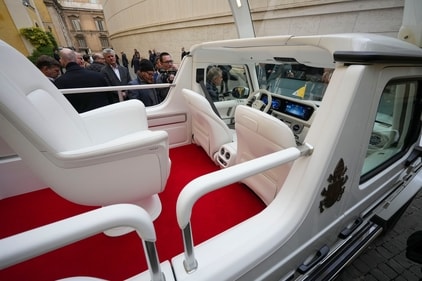 TV crews film the new fully electric popemobile that was presented to Pope Francis, at the Vatican, (AP) TV crews film the new fully electric popemobile that was presented to Pope Francis, at the Vatican, (AP)