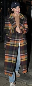 Lily Collins channeled countryside core with a statement-making coat while being out in London. Lily Collins channeled countryside core with a statement-making coat while being out in London.