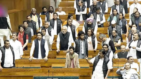 Opposition MPs raise slogans in the Lok Sabha during the Winter Session of Parliament, in New Delhi on Wednesday. (Sansad TV/ ANI)
