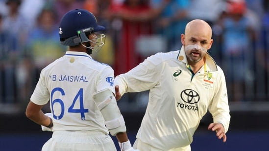 Australia's Nathan Lyon collides with India's Yashasvi Jaiswal as he runs to field (AP)