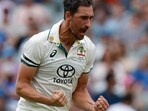 Australia's Mitchell Starc celebrates the dismissal of India's Virat Kohli during the day one of the second cricket test match between Australia and India at the Adelaide Oval in Adelaide, Australia, Friday, Dec. 6, 2024. (AP Photo/James Elsby)