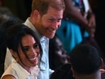 Britain's Prince Harry (back), Duke of Sussex, and his wife Meghan Markle (L) greet Colombia's vice-President Francia Marquez.